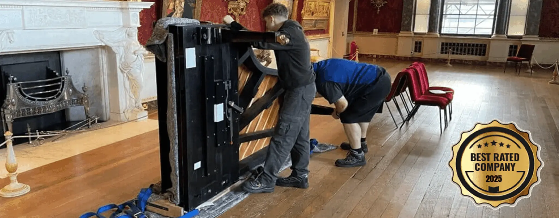 Bellwoods specialist piano removal team manoeuvring a grand piano in a formal hall — grand piano removals across West Yorkshire